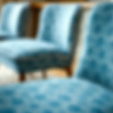 Close-up detail of fabric textures on blue patterned dining chairs