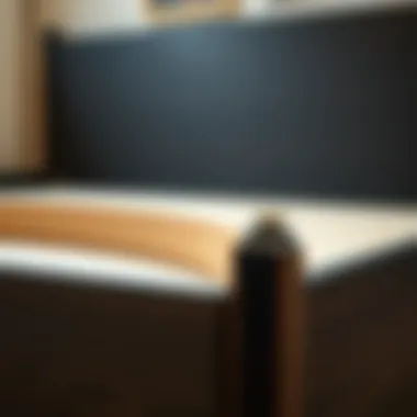 Close-up of the material used in a black wooden king size bed frame emphasizing durability