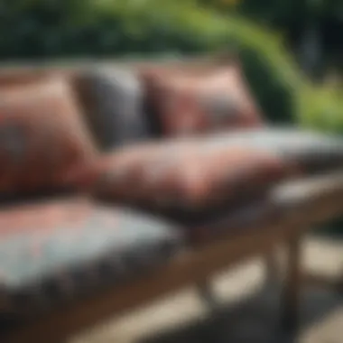 A selection of patterned cushions displayed on a garden bench.