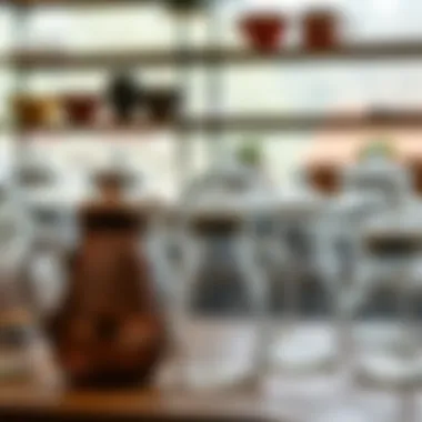 Various designs of glass pitchers with lids displayed