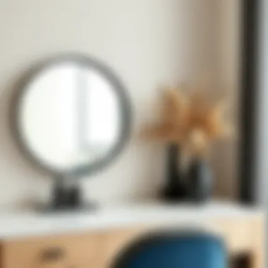 Round mirror with black trim on a stylish vanity setup