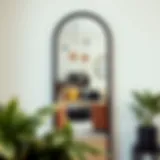 Elegant tall black arch mirror reflecting a stylish urban living space