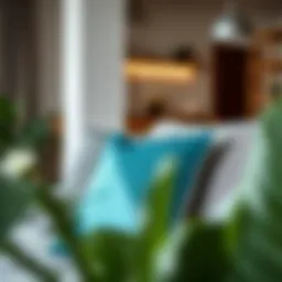 Stylish teal pillow on a modern gray couch